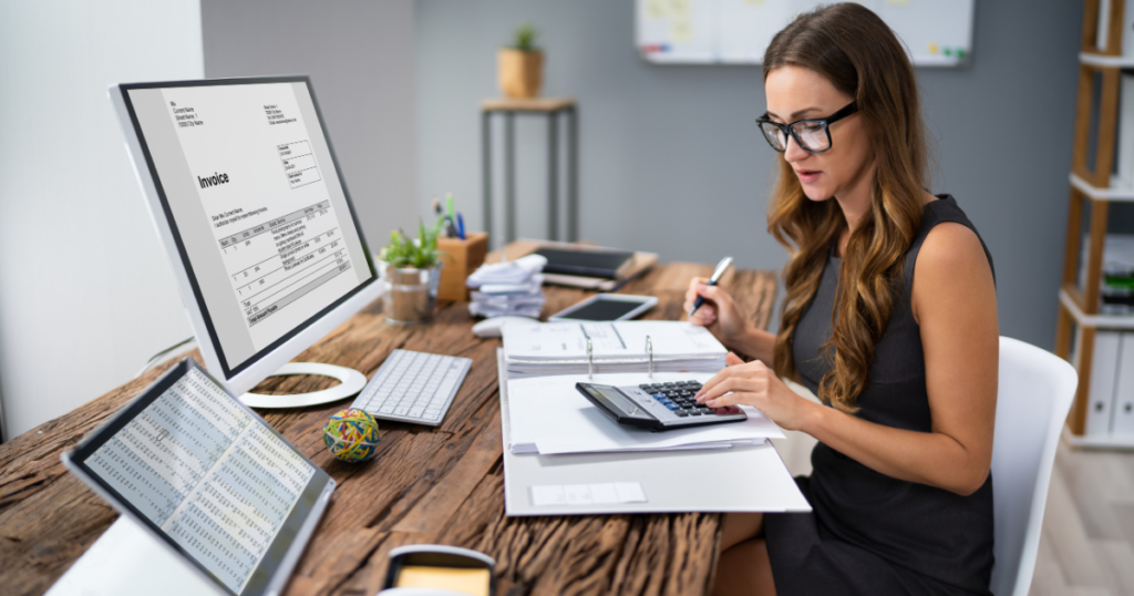 Tax deduction blog featured image showing receipts, calculator and paperwork